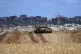 An Israeli tank overlooks the Gaza Strip, as seen from south