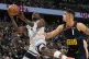 Minnesota Timberwolves guard Anthony Edwards (left) drives p
