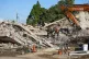 Rescue personnel search the site of a building collapse in G