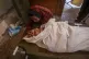 Palestinians mourn their relatives killed by the Israeli bom
