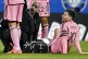 Inter Miami's Lionel Messi is tended to by team trainers dur