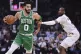 Boston Celtics forward Jayson Tatum (0) drives against Cleve