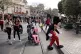 Visitors follow Mickey Mouse for photos at Disneyland, Janua