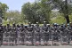 Police personnel form a barricade as supporters of Aam Aadmi