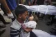 Karam Harara holds the body of his 2-year-old daughter Sabre