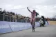 Tadej Pogačar celebrates as he wins at the end of the 15th 