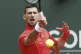 Serbia's Novak Djokovic returns a ball to Germany's Yannick 