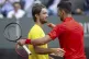 Novak Djokovic (right) of Serbia, congratulates the match wi