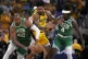 Indiana Pacers forward Obi Toppin (centre) fights for a loos