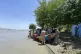 People push the sunken boat from river in Mohmand Dara distr