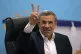 Iran's former President Mahmoud Ahmadinejad flashes a victor