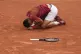 Serbia's Novak Djokovic slipped and fell during his fourth r