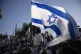 Israelis wave national flags during a march marking Jerusale