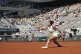Italy's Jasmine Paolini plays a shot against Russia's Mirra 