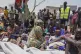 South Sudanese who fled from Sudan sit outside a nutrition c