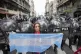 An anti-government protester holds an Argentine flag by poli