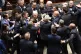 5-Star Movement lawmaker Leonardo Donno, center top, is prot