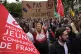 A protester holds an anti-far right banner during a rally in