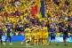 Players of Romania celebrate at the end of a Group E match b
