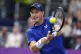 Andy Murray of Britain plays a return to Jordan Thompson of 