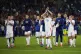 Italy's Bryan Cristante (16) and other players leave the fie