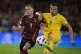Belgium's Leandro Trossard (left) challenges for the ball wi
