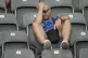 A fan sits in dispair after Italy lose 2-0 to Switzerland