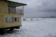 Waves batter a pier during the pass of Hurricane Beryl in Br
