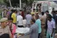 Relatives and volunteers carry the bodies on stretchers at t