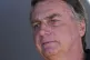 Former Brazilian President Jair Bolsonaro talks with support