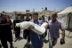 A Palestinian man holds the body of a child killed in the Is