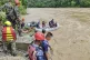 Rescuers looking for the survivors after two buses were swep