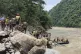 Nepal army personnel cary out a search operation looking for
