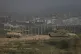 Israeli tanks stand near the Israel-Gaza border as seen from