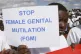 A Masai girl holds a protest sign during the anti-Female Gen