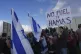 Israeli police prevent activists from blocking trucks carryi