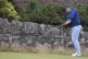 Rory McIlroy of Northern Ireland watches his chip shot durin