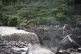 Excavators remove debris from a bridge in the aftermath of f
