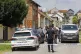 Police and forensics gather near the crime scene in Daruvar,