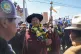 Bolivia's former President Evo Morales holds an Indigenous s