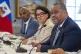 Haiti's Prime Minister Garry Conille (right) sits next to Fo