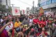 Activists play music and sing during a song march to remembe