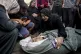 
	Palestinians mourn for a relative killed in the Israeli bo