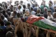 Mourners carry a Palestinian killed by Israeli fire in the W