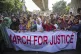 University students shout slogans during a protest to demand