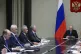 Russian President Vladimir Putin (right) attends a meeting w