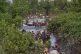 Groups of Rohingya Muslims cross the Naf river at the border