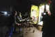 Russian Emergency paramedics roll a stretcher with a residen