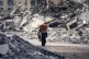 A Palestinian displaced woman by the Israeli air and ground 