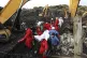 Red Cross personnel carry the body of a victim at the site o
